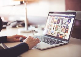 Computer, desk, typing — Prioritizing Self-Care: The Role of Massage on Business Trips