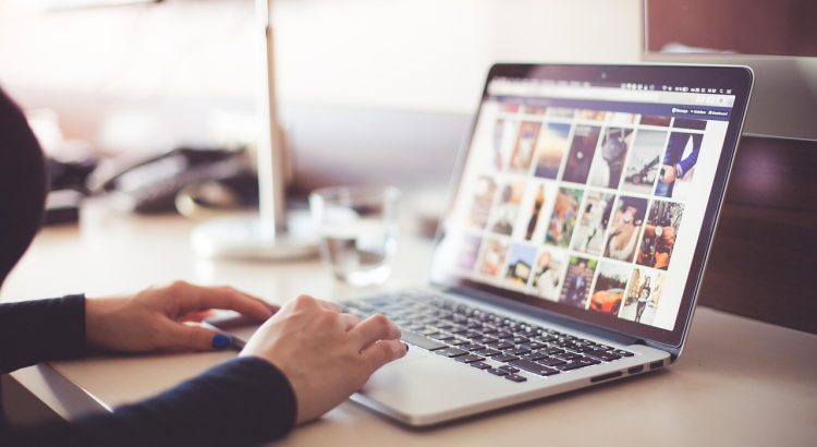 Computer, desk, typing — Prioritizing Self-Care: The Role of Massage on Business Trips
